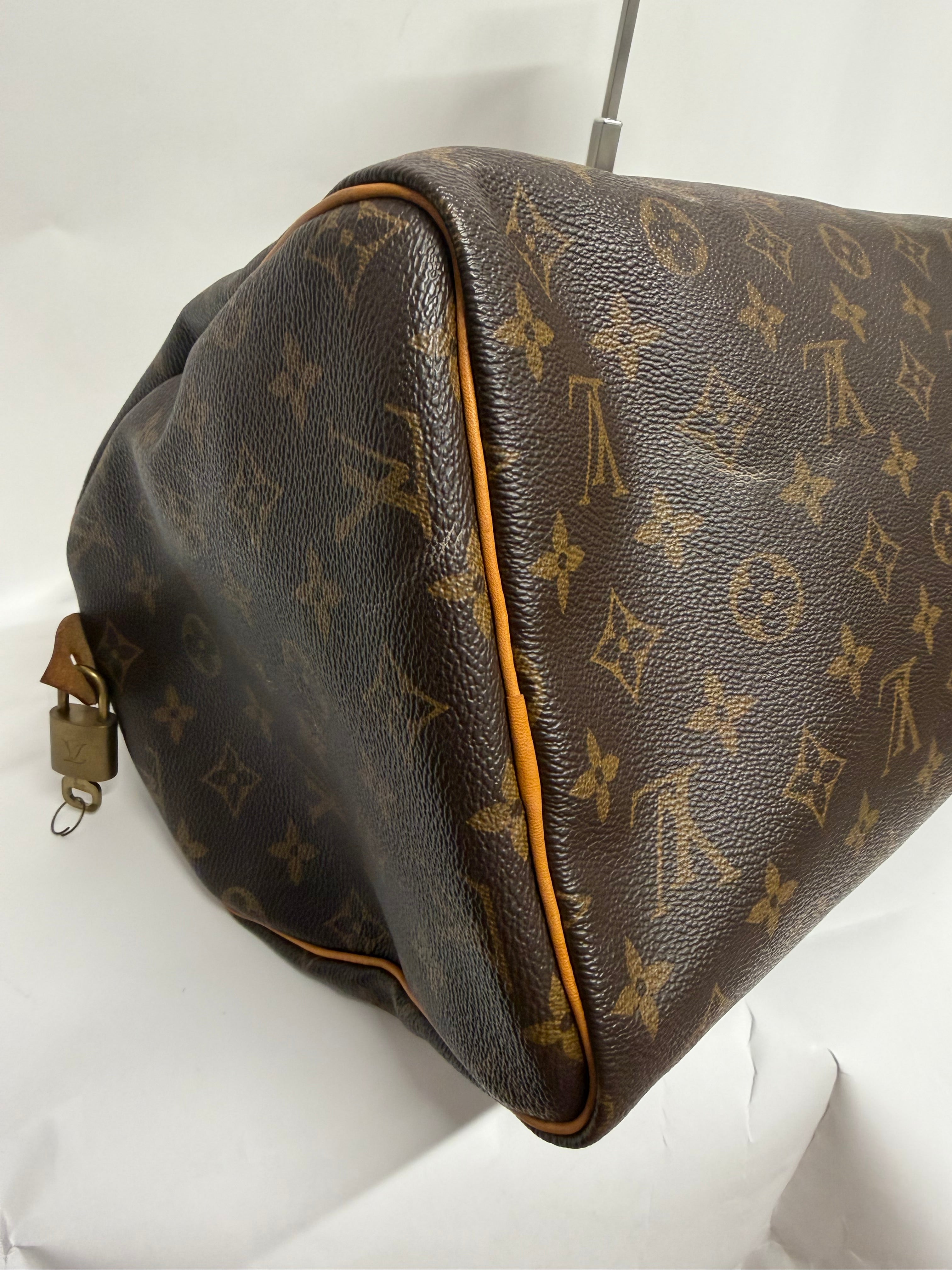 Louis Vuitton Speedy 30 Monogram con bandolera extra