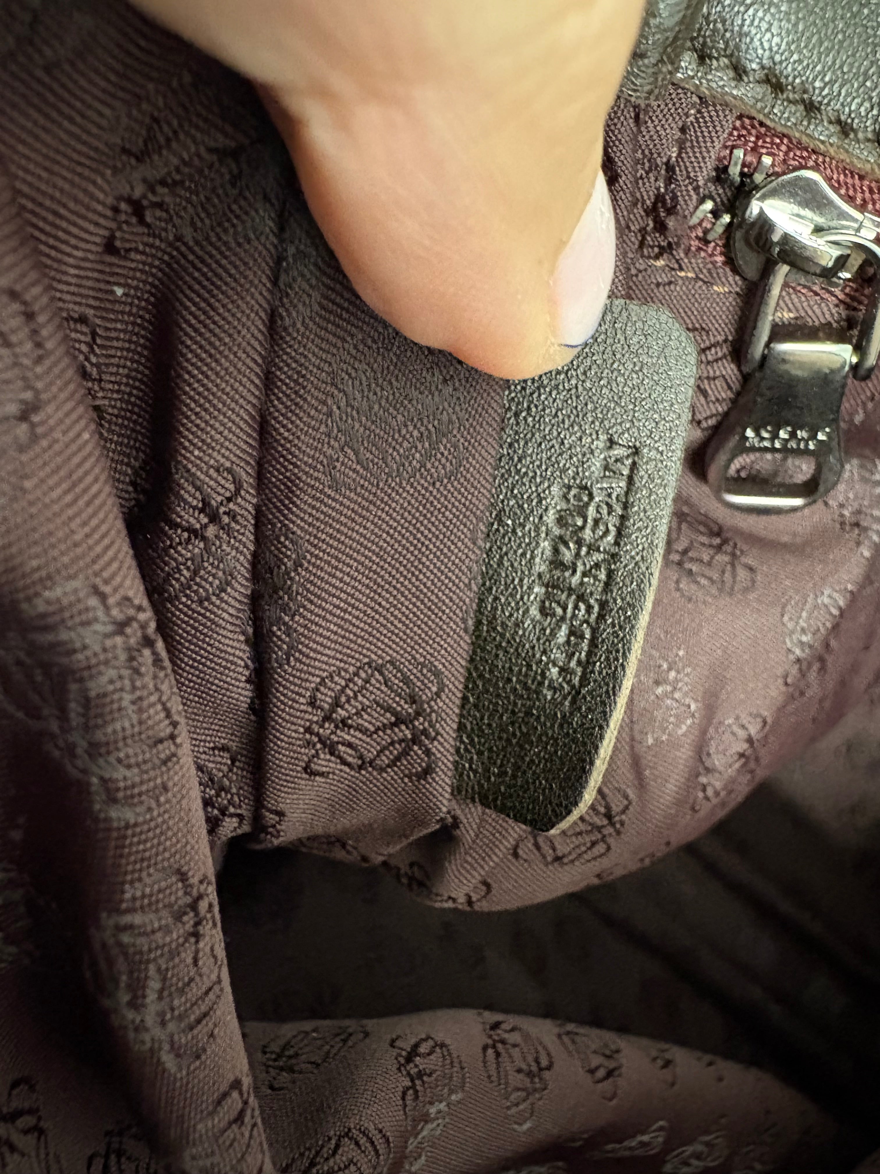 Loewe flamenco mediano burdeos y marrones con bandolera y borlas