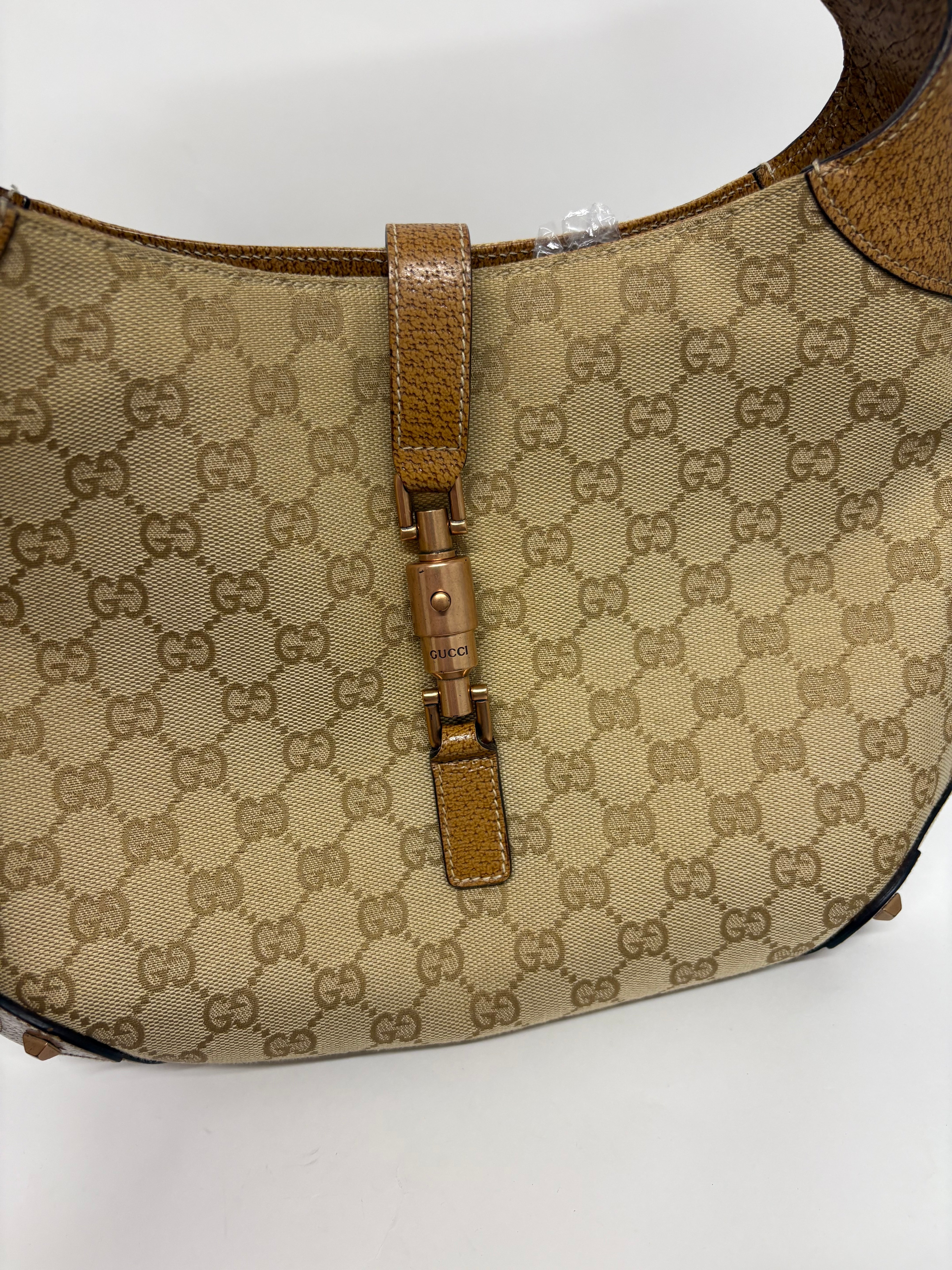 Gucci jackie gg canvas gold rosado y marron