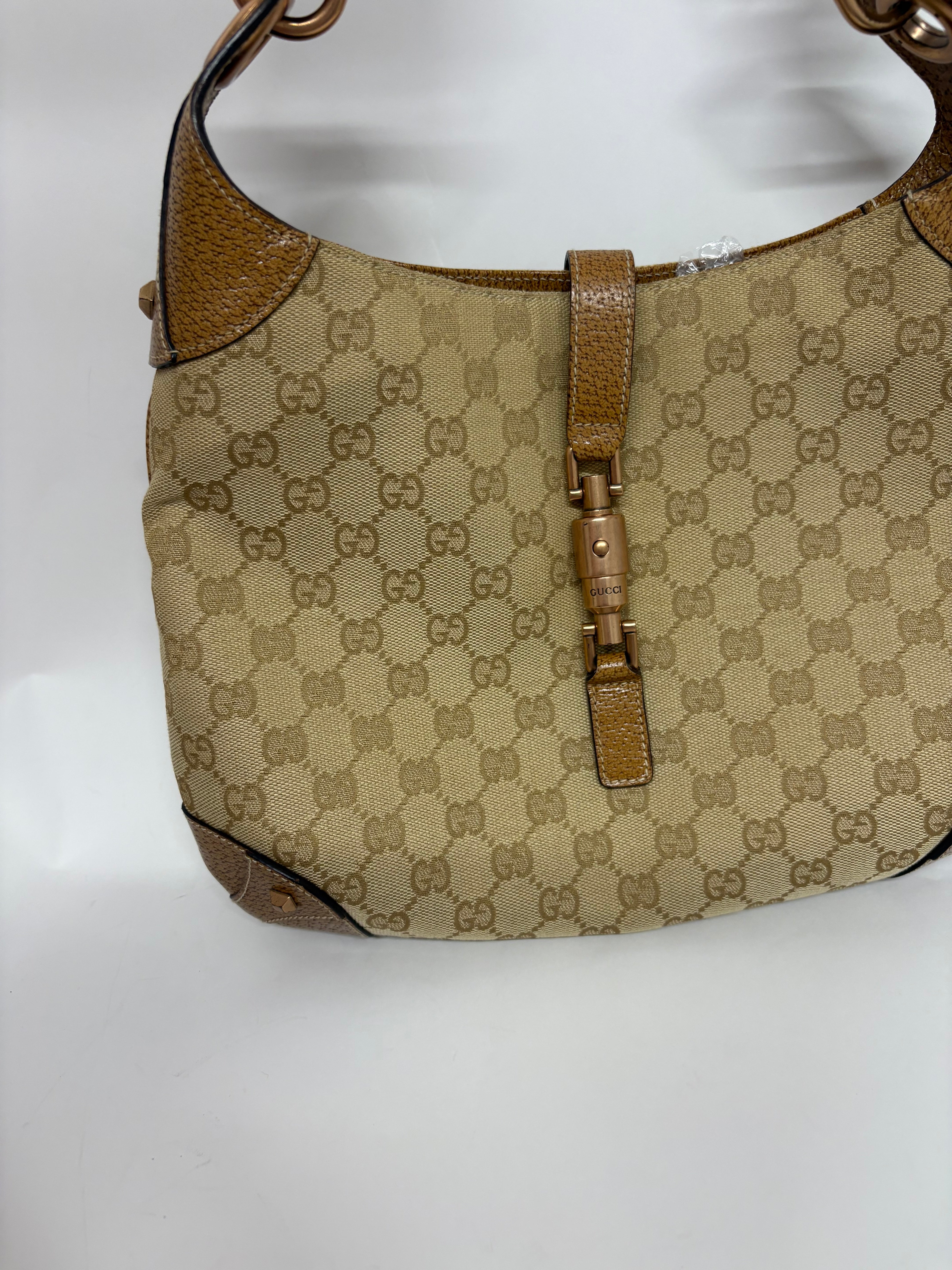 Gucci jackie gg canvas gold rosado y marron