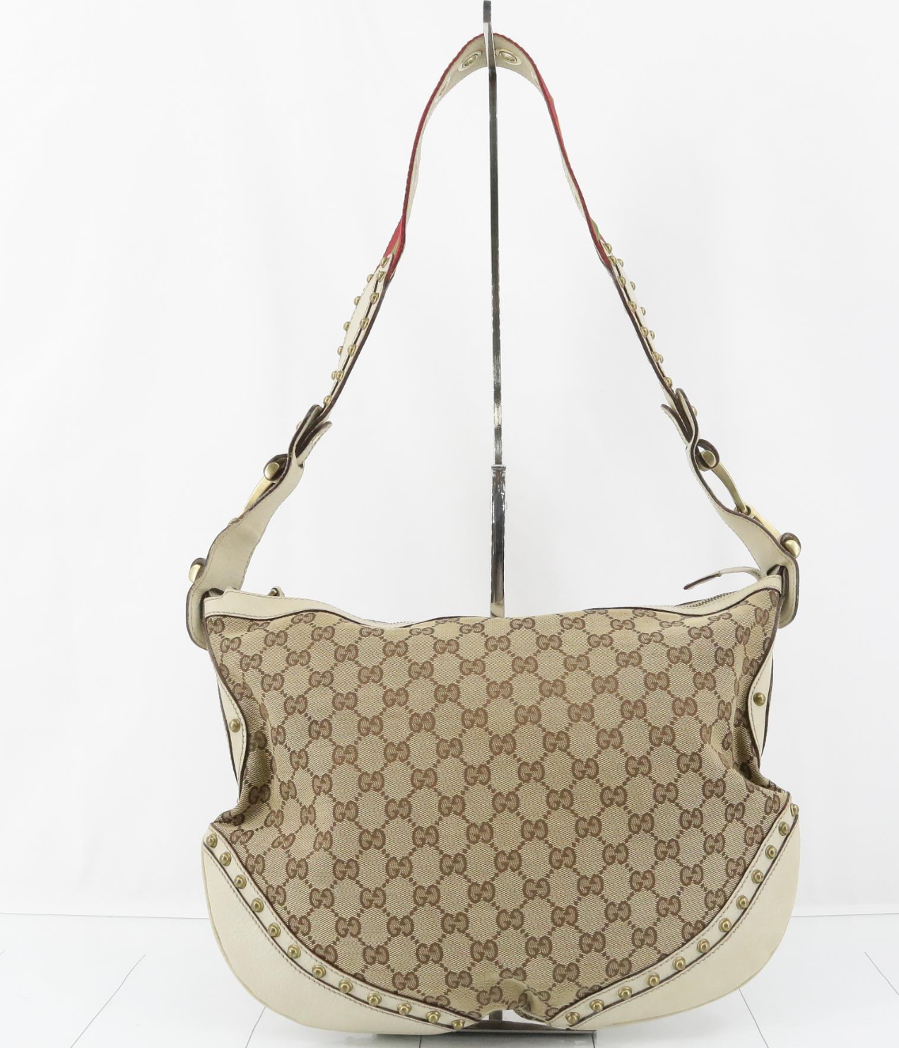 Gucci Pelham GG Canvas con tachuelas, piel blanca y bandolera