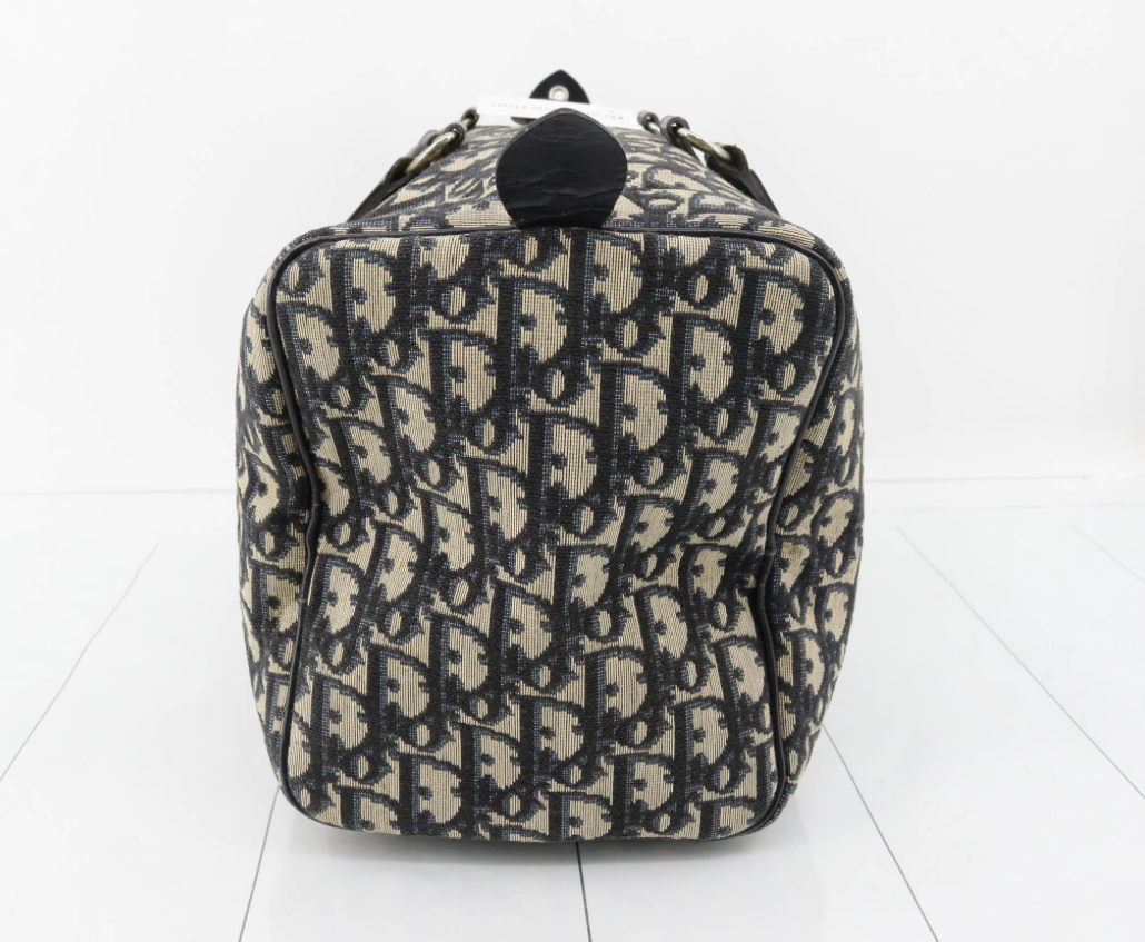 Christian Dior Trotter Boston Bag en canvas monogram azul y cuero