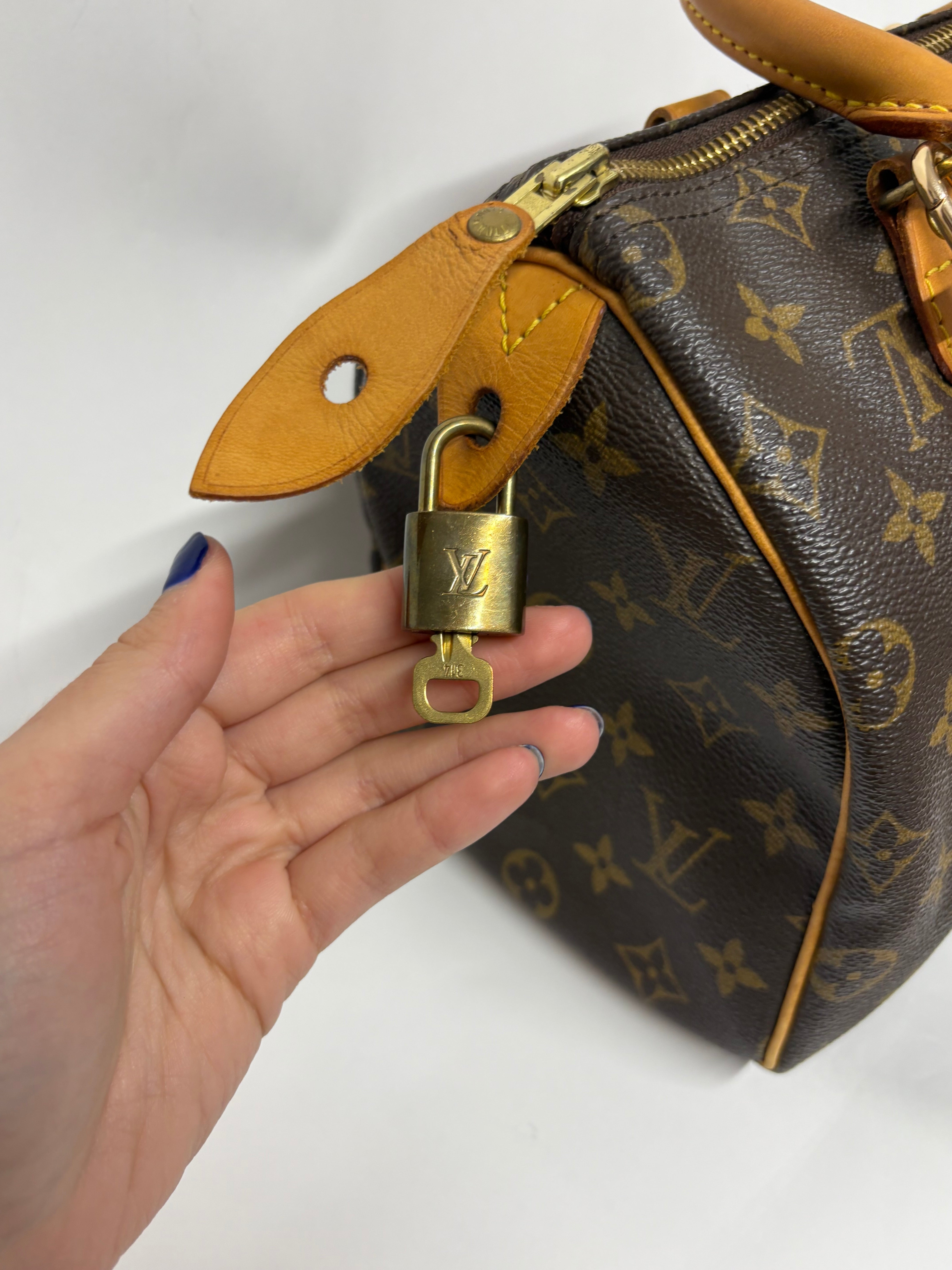 Louis Vuitton Speedy 25 Monogram con bandolera extra