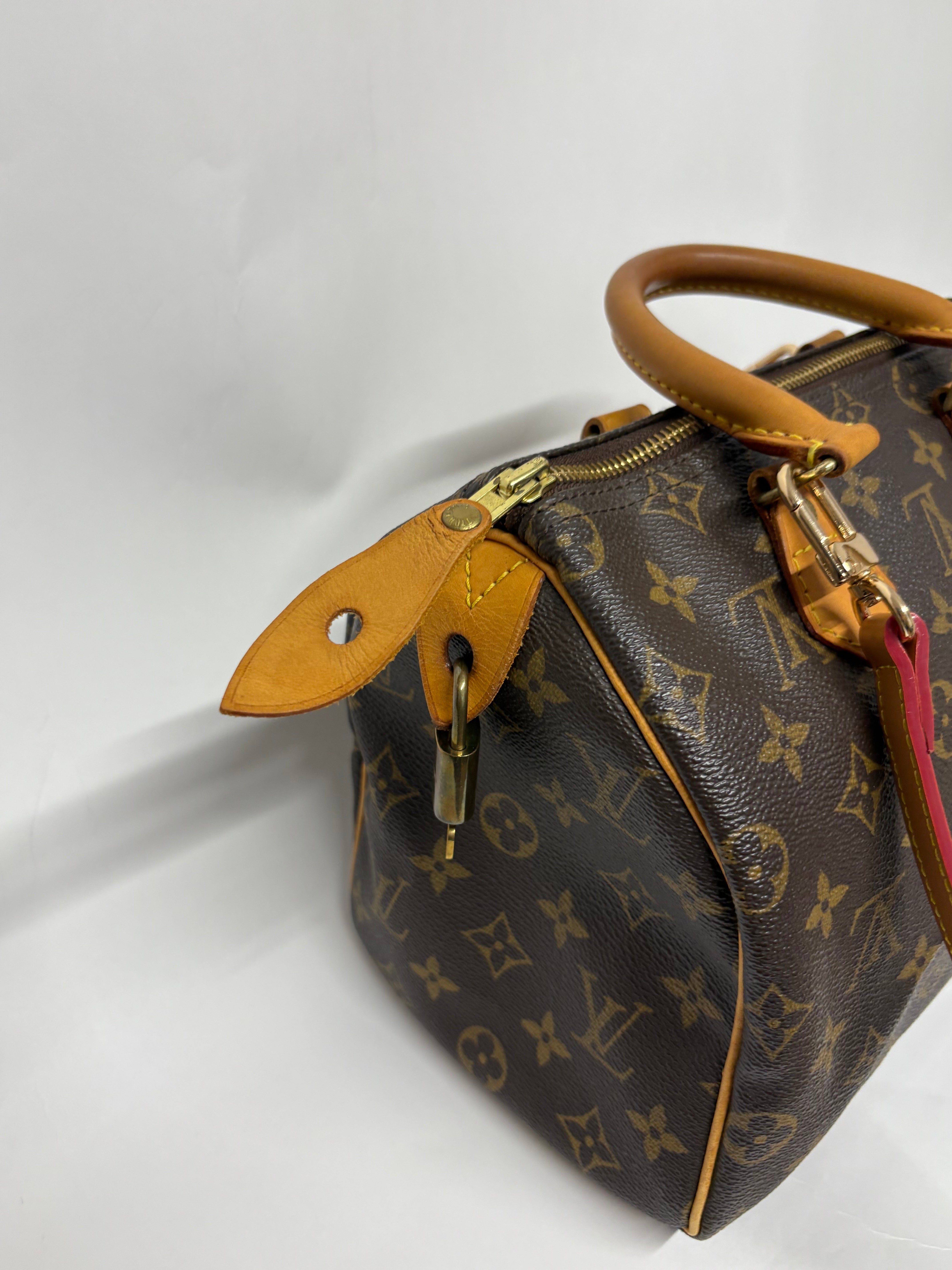 Louis Vuitton Speedy 25 Monogram con bandolera extra