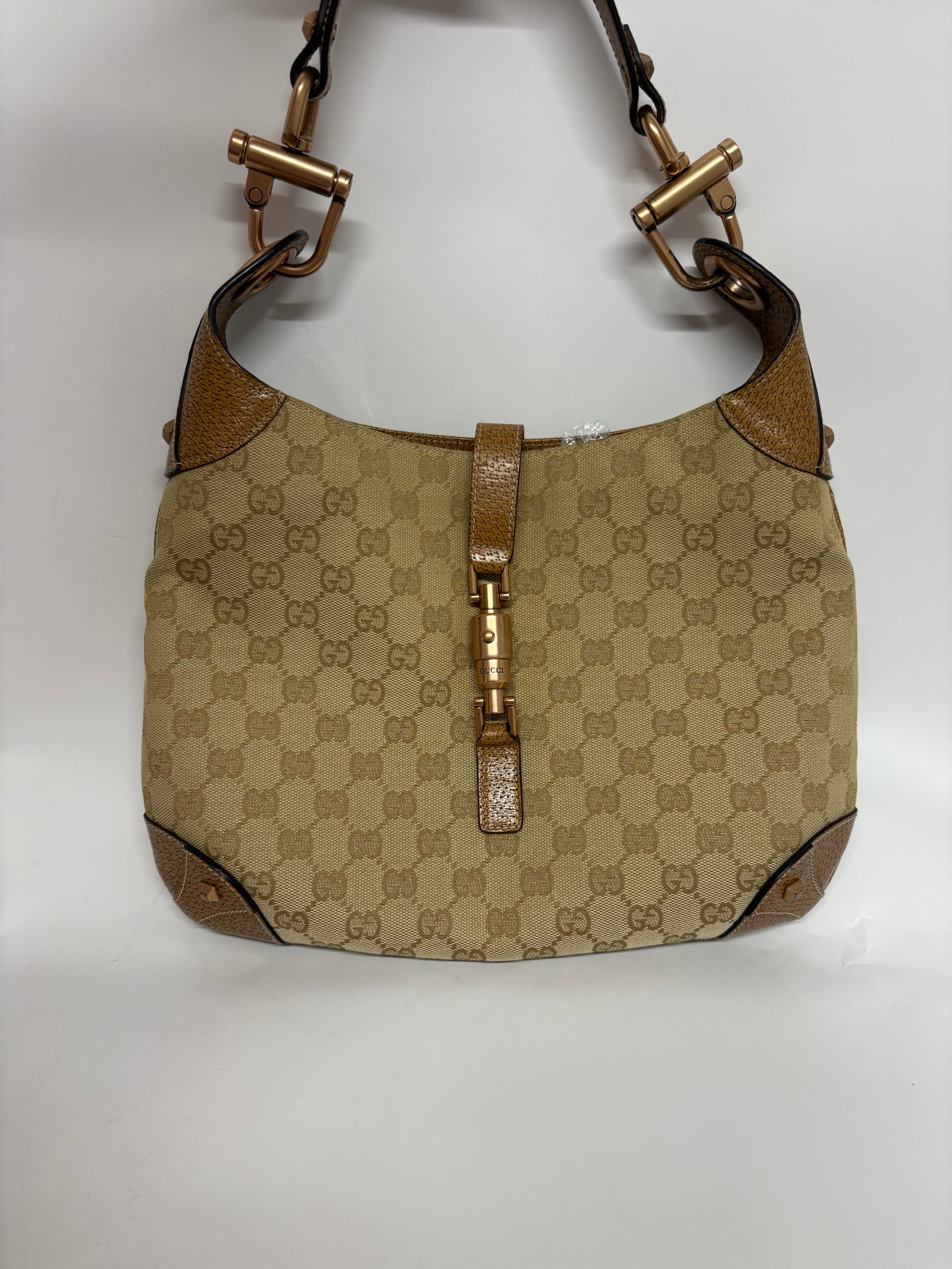 Gucci jackie gg canvas gold rosado y marron