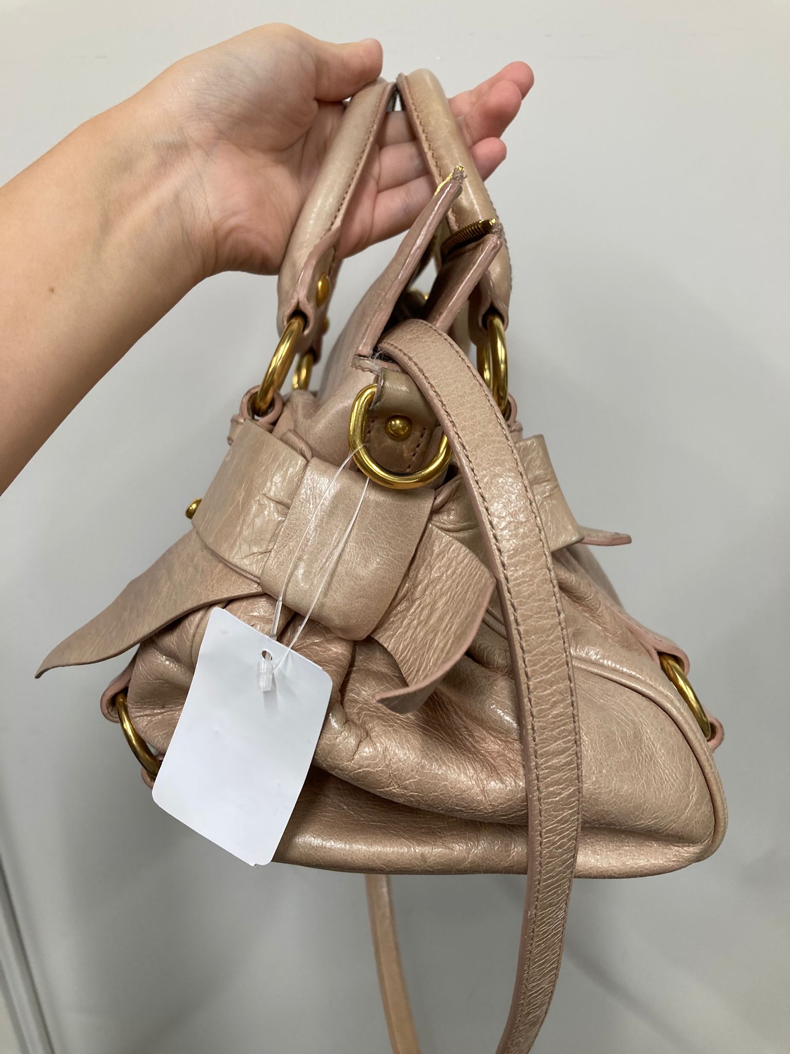 Miu Miu Vitello small rosa claro con bandolera
