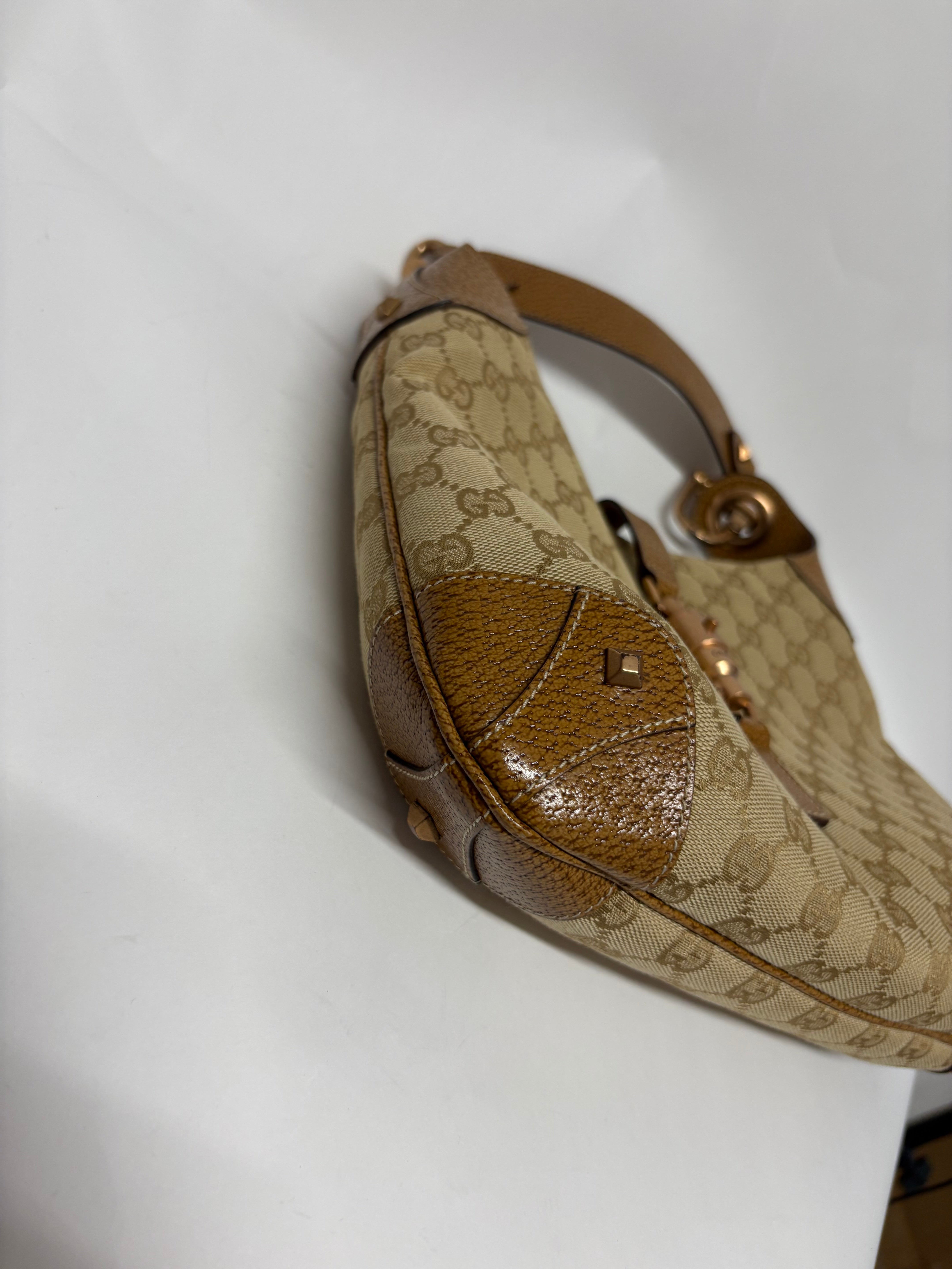 Gucci jackie gg canvas gold rosado y marron