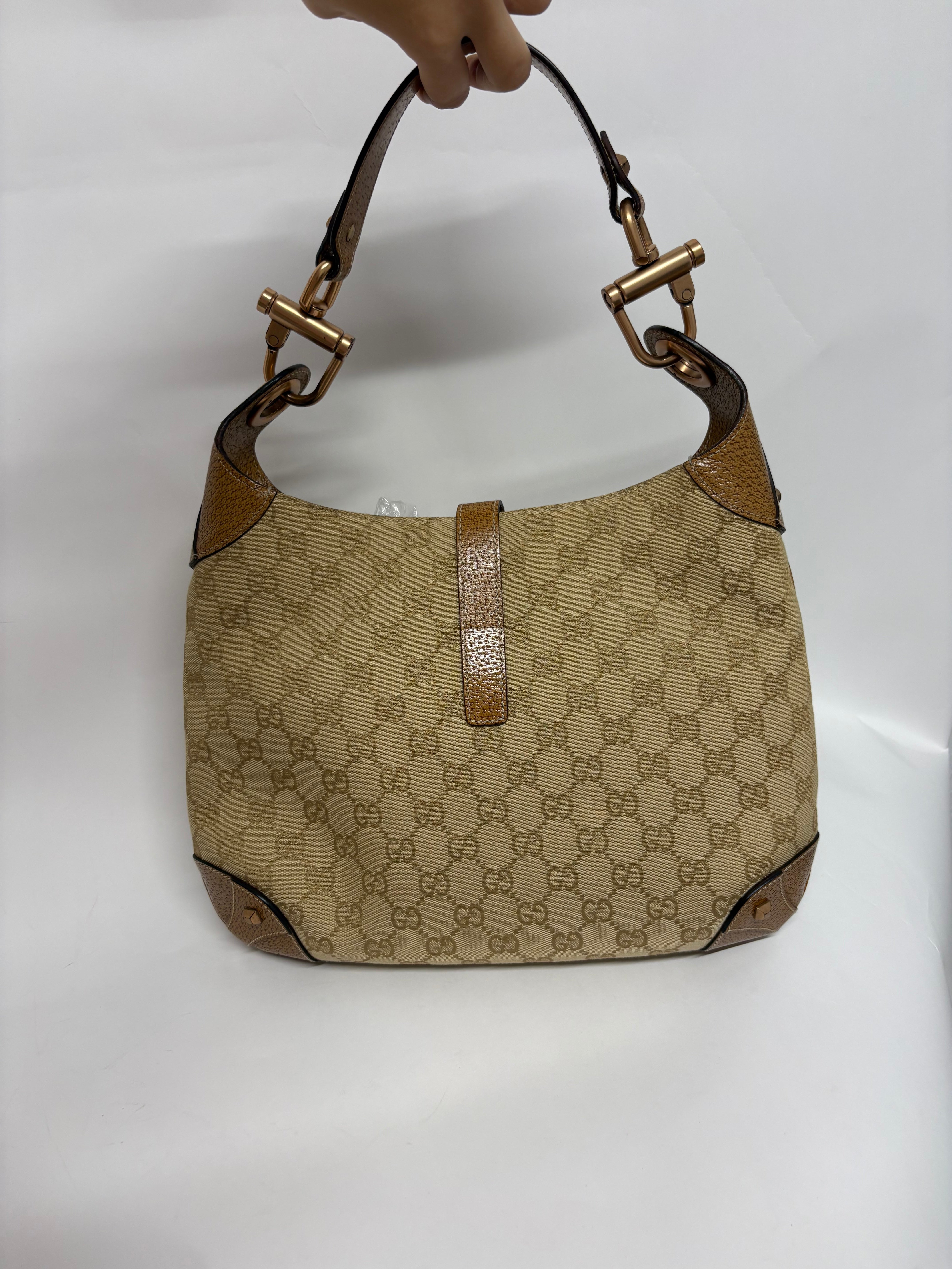 Gucci jackie gg canvas gold rosado y marron