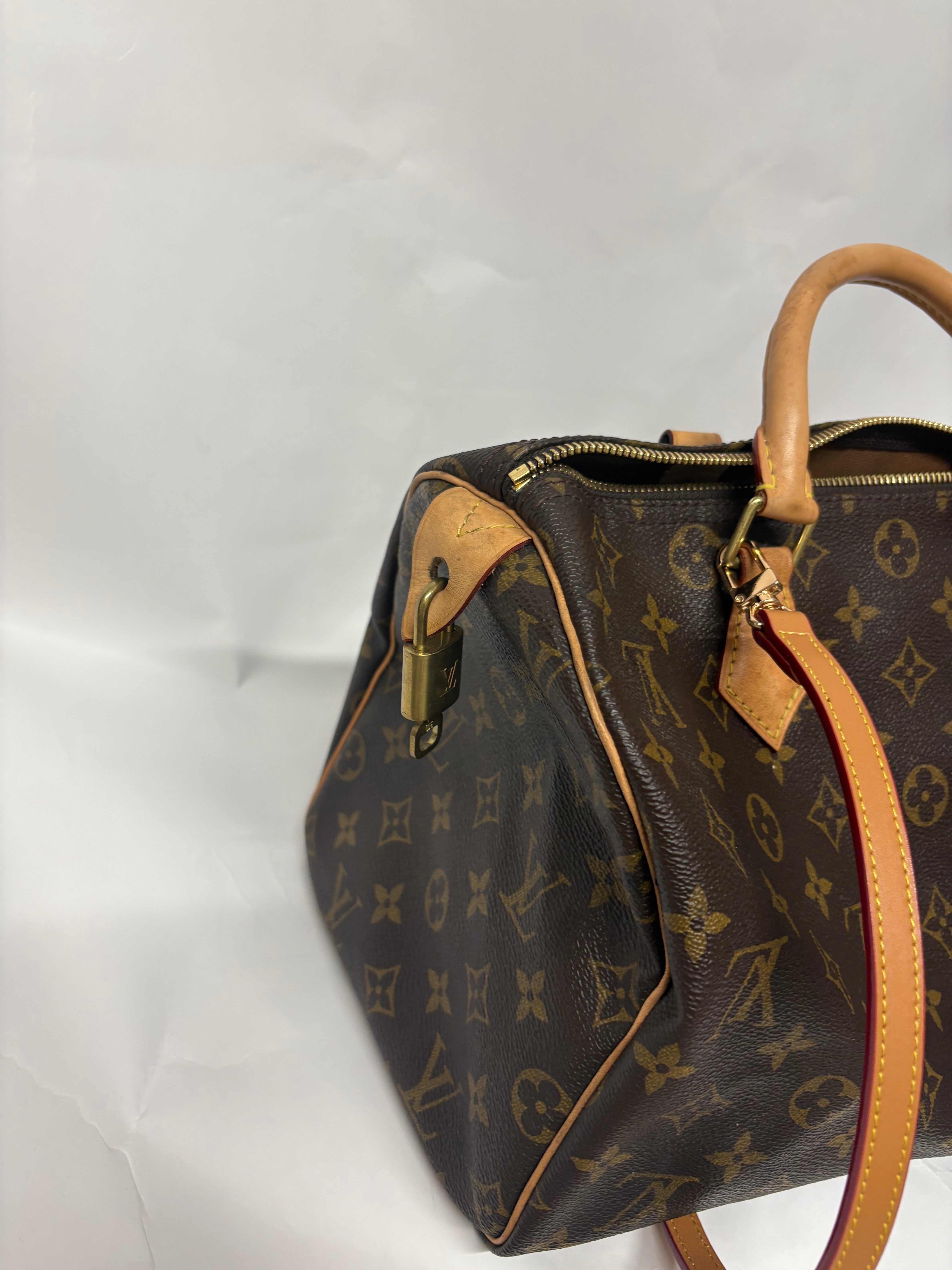 Louis Vuitton Speedy 30 Monogram con bandolera extra