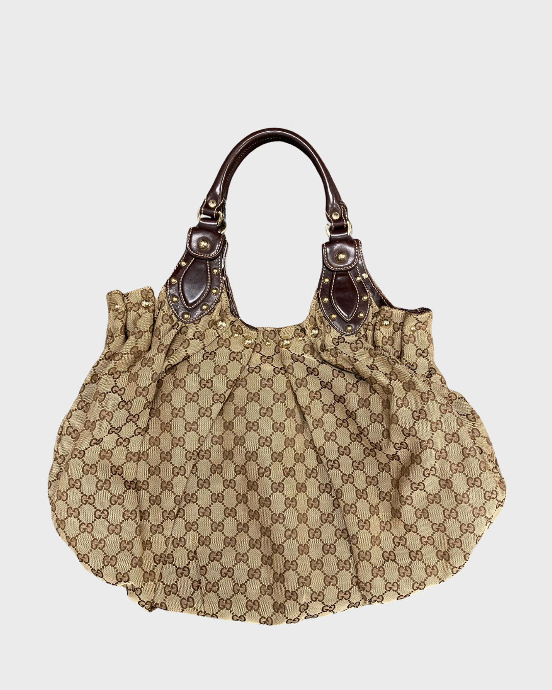Gucci Pelham GG canvas y tachuelas