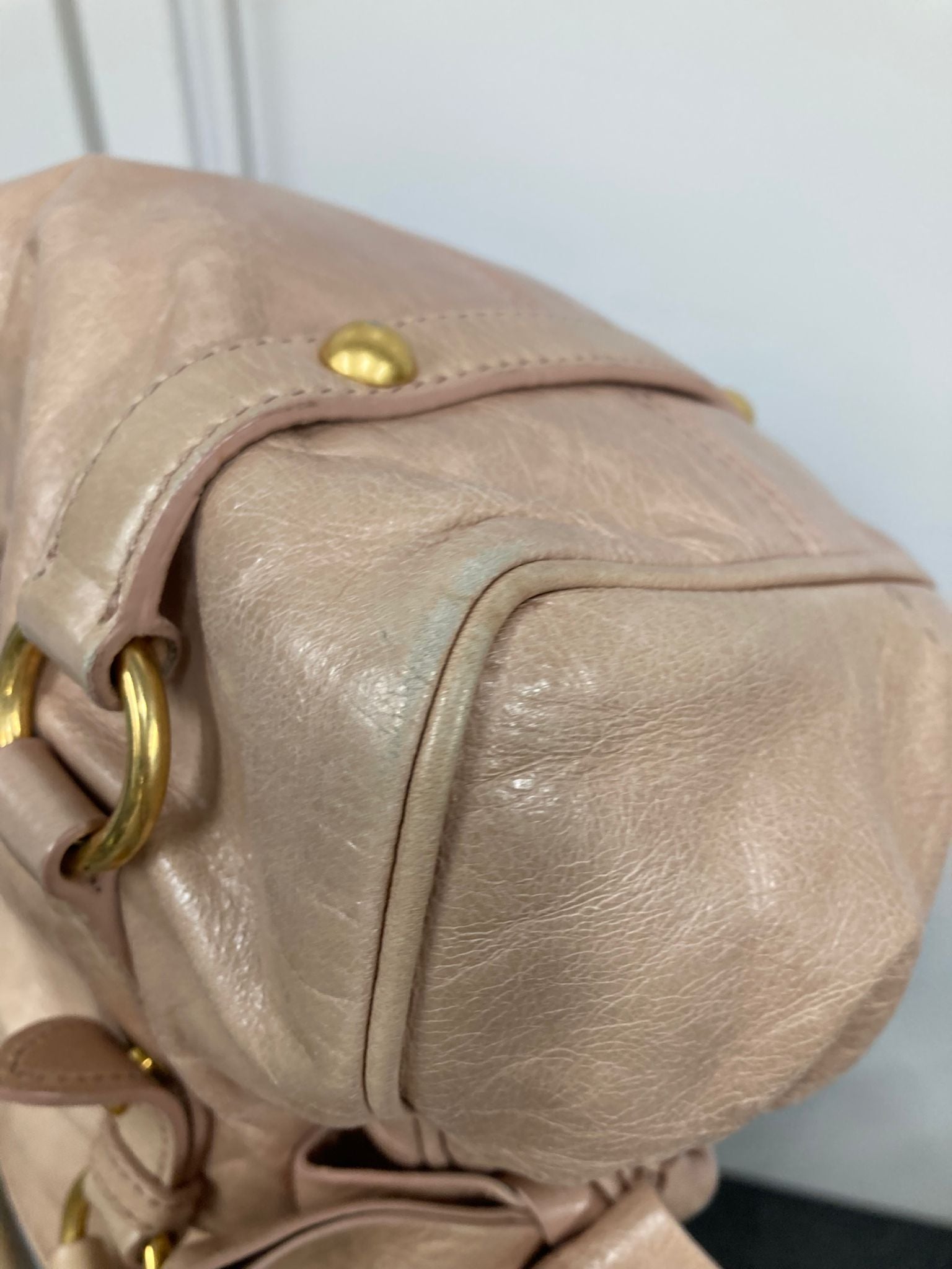 Miu Miu Vitello small rosa claro con bandolera